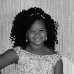 Black and white headshot for Imanda Covington. Black female child.