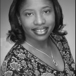 Black and white headshot for Janean Hightower. Black female with short hair.