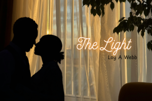 Show graphic for the light. A lighted window in the background. In the foreground there is a silhouette of a man and a woman to the left and a silhouettes of a plant to the right. The words "The Light Loy A.Webb:" are printed in the center of the graphic.